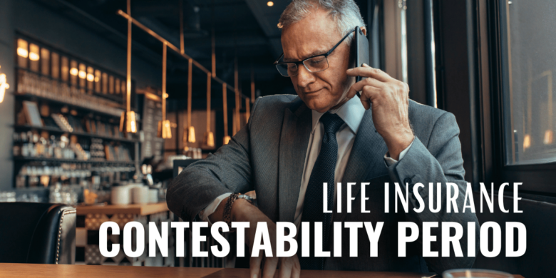 Senior man checking his watch while conversing on the phone.